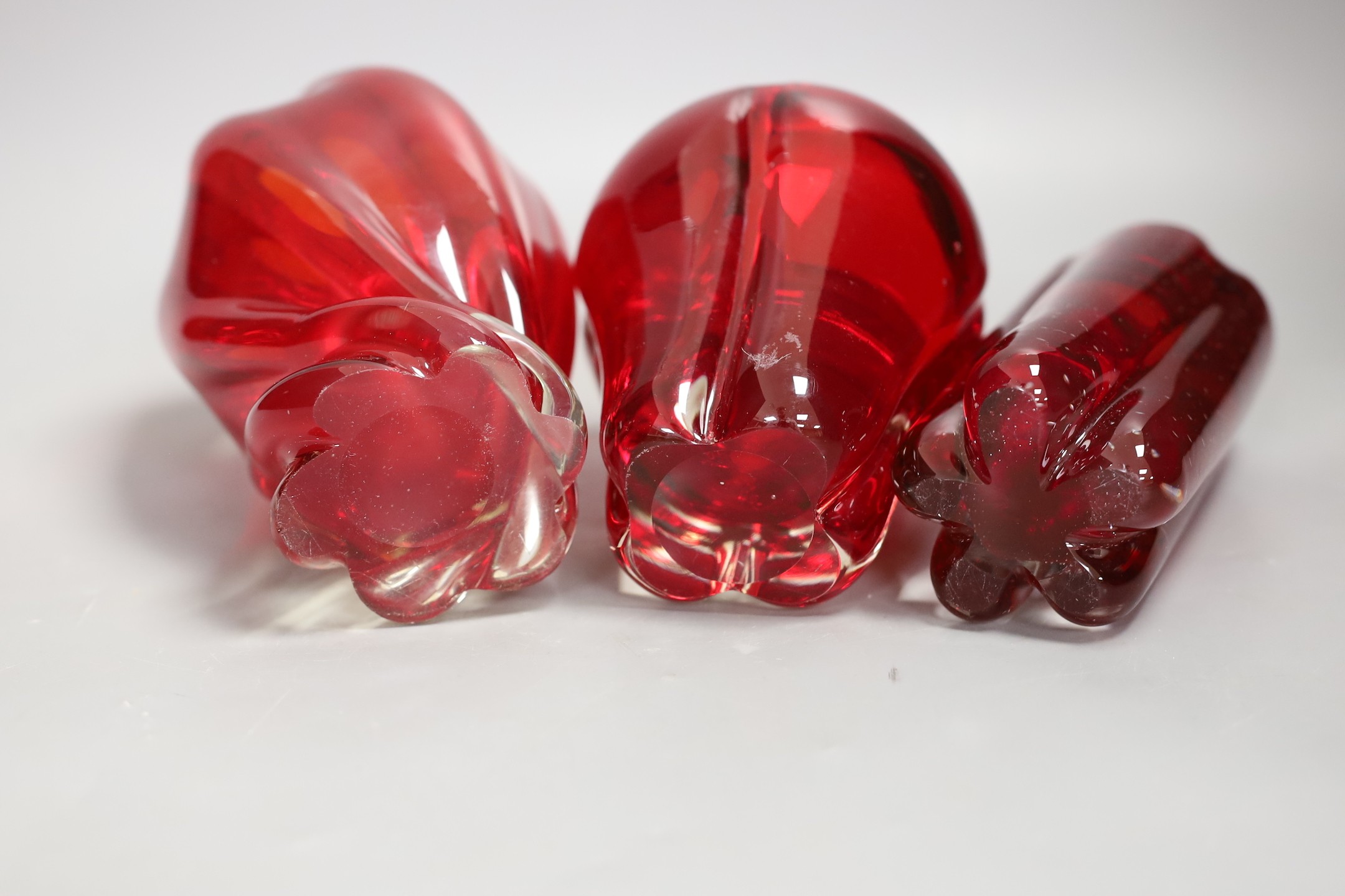 Three Whitefriars red glass vases, tallest 18cms high